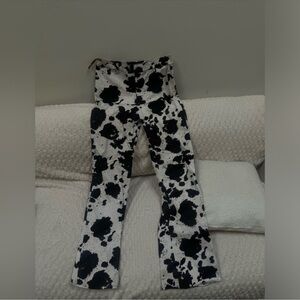 Motel Black and White Cow Print Flared Pants